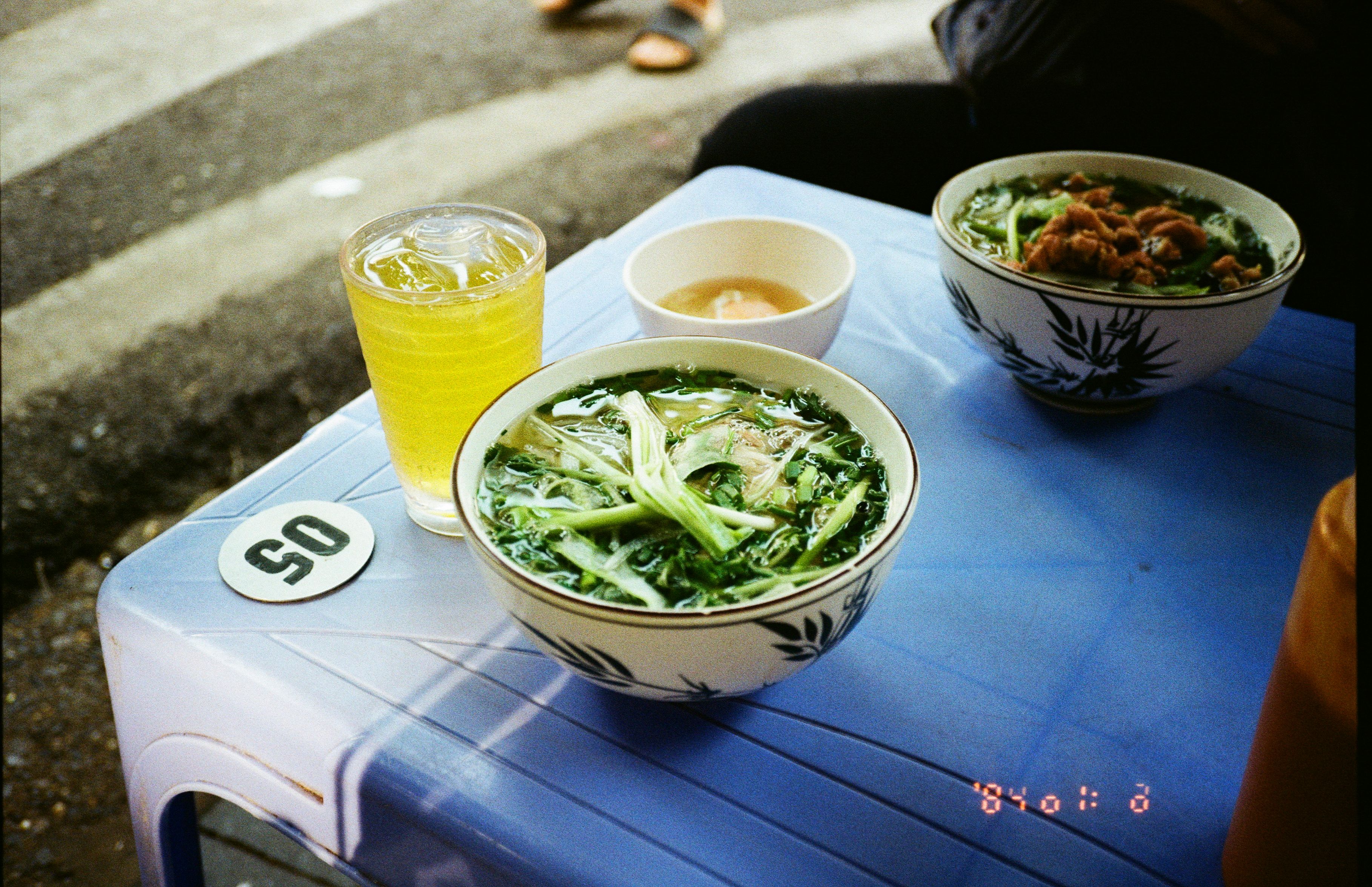 Hanoi's Dong Xuan Market at 5 AM — the pho stalls that vanish by sunrise